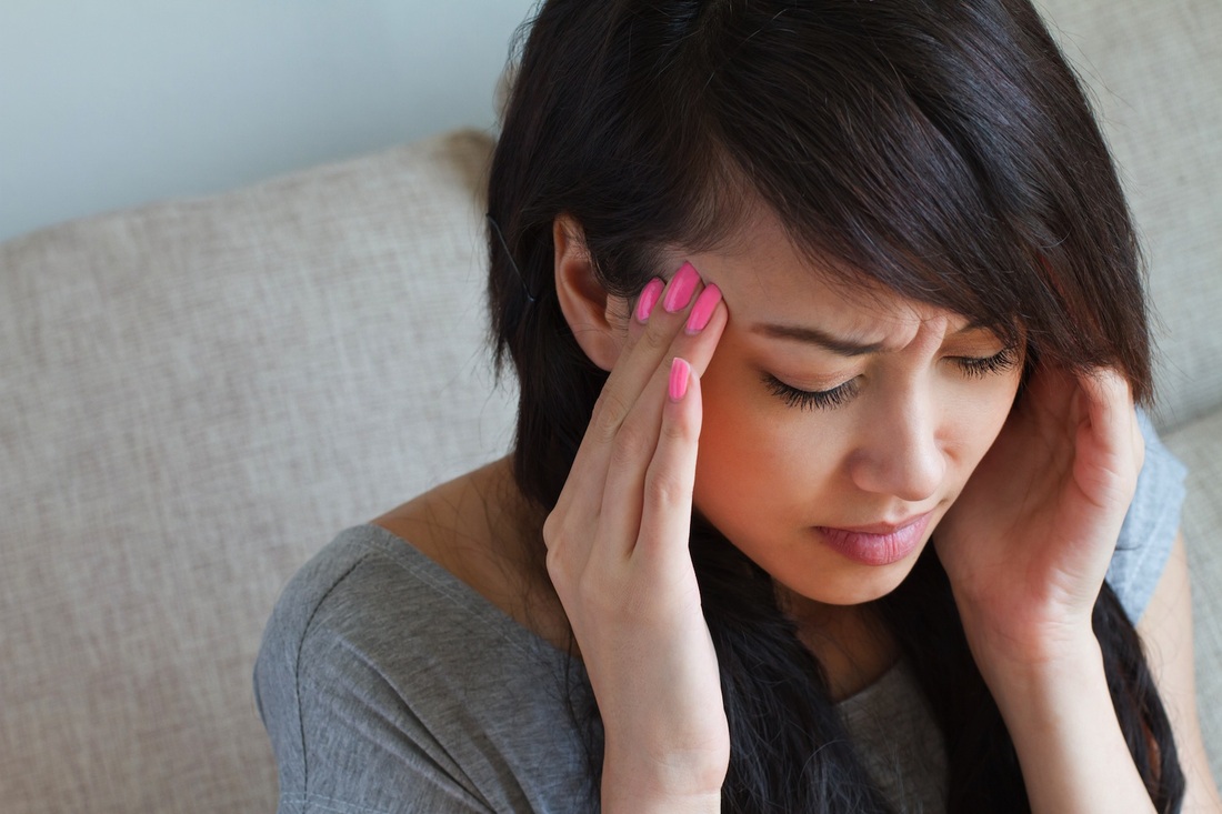 Woman with muscle tension headache
